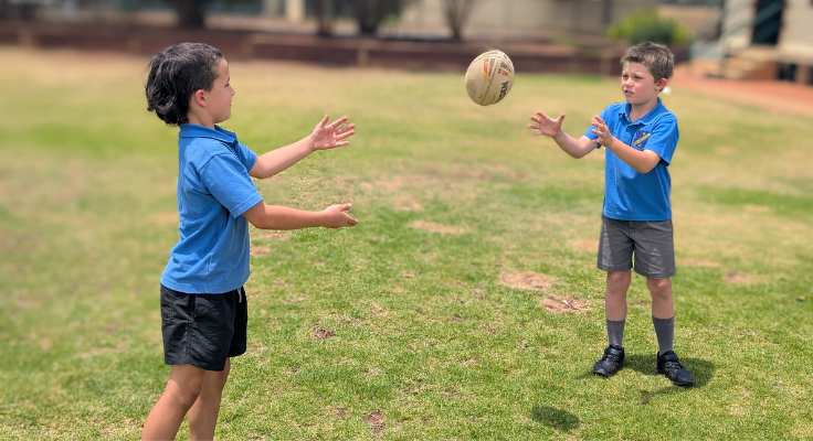 students playing with a football