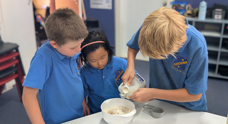 students measuring ingredients for cooking while in class