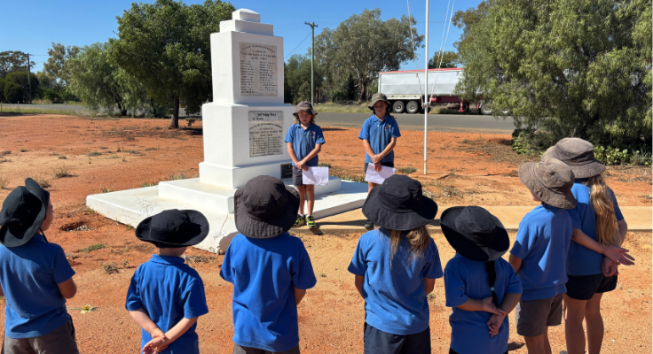 Hermidale PS students pictured at the Hermidale Cenotaph for ANZAC Day